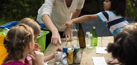 kids learning to sort recyclables